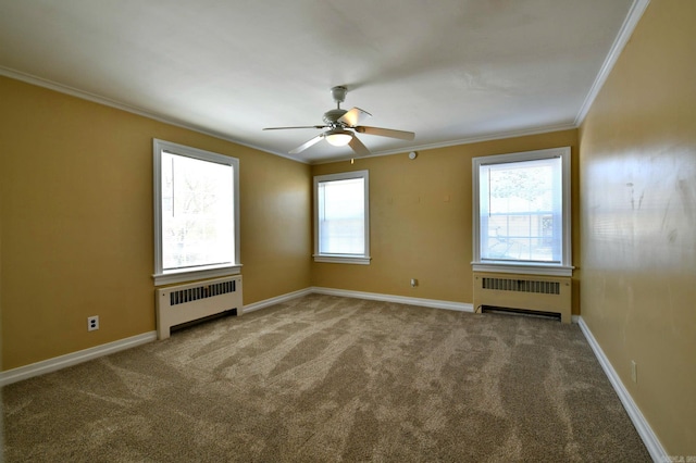 unfurnished room with ceiling fan, crown molding, radiator heating unit, and carpet floors