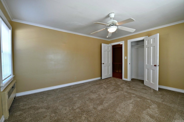 unfurnished bedroom featuring ceiling fan, carpet flooring, and ornamental molding