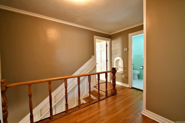 301 Reine St, Mena, AR 71953 - stairs featuring baseboards, ornamental molding, and wood finished floors