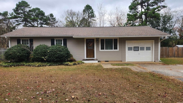 ranch-style home with a front lawn and a garage