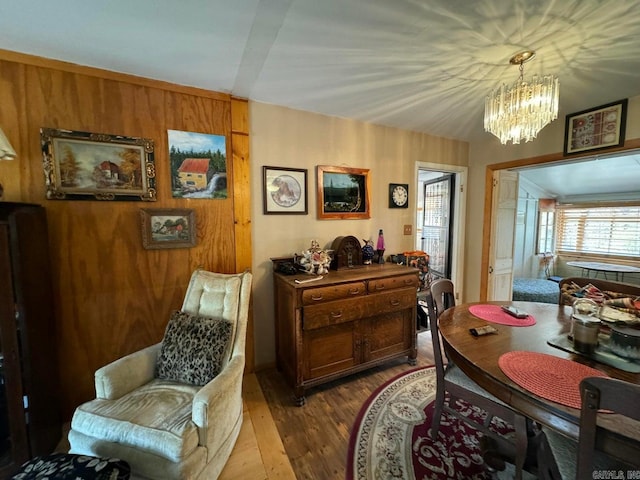 dining room with an inviting chandelier and hardwood / wood-style floors