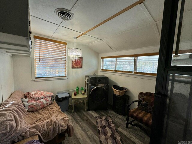 living area with vaulted ceiling and dark hardwood / wood-style floors