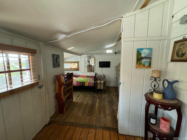 bedroom with lofted ceiling and dark wood-type flooring