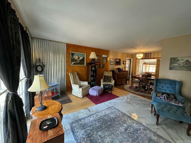 living room featuring wood walls and wood-type flooring