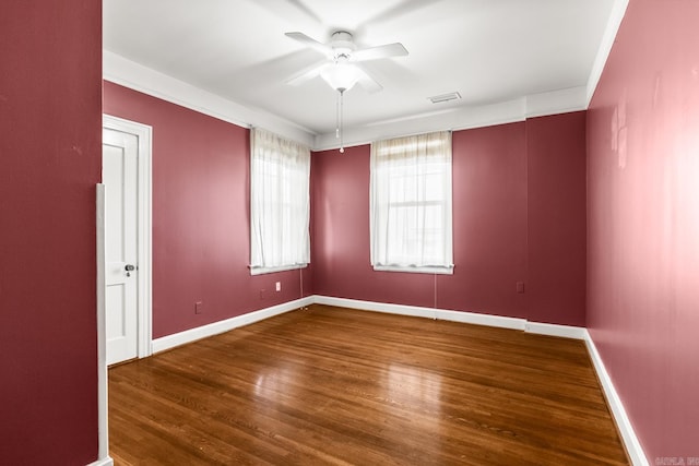 spare room with hardwood / wood-style flooring and ceiling fan