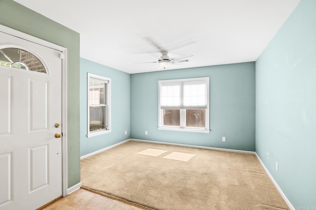 carpeted empty room with ceiling fan