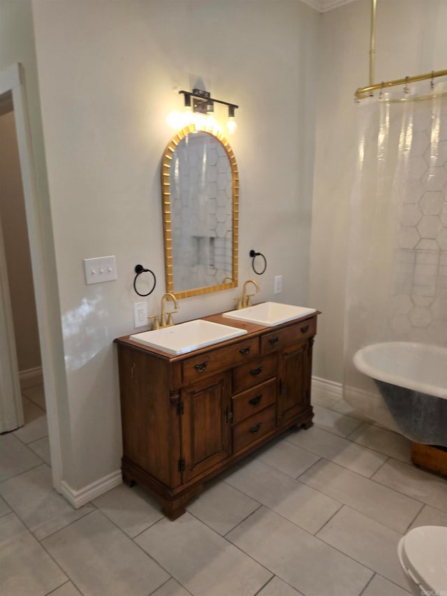 bathroom with tile patterned flooring, vanity, and a tub to relax in