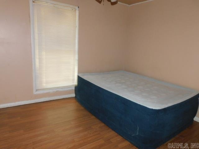 bedroom featuring hardwood / wood-style flooring