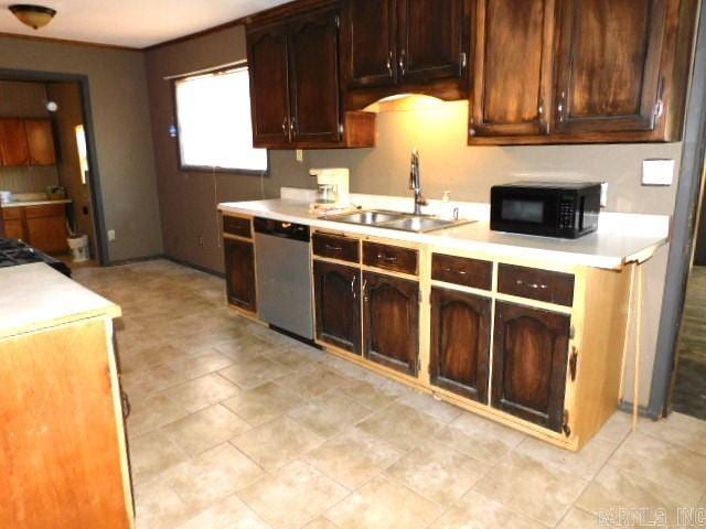 kitchen with sink, dishwasher, and dark brown cabinetry