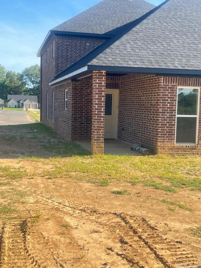 view of property exterior featuring a patio