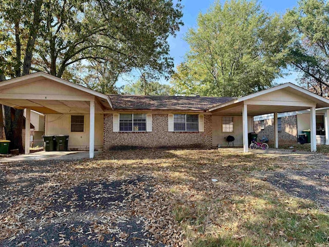 single story home with a carport