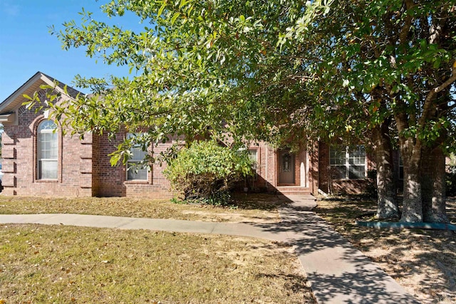 view of property hidden behind natural elements