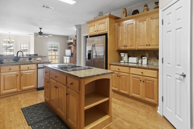 kitchen with stainless steel refrigerator with ice dispenser, black electric cooktop, a sink, light wood-style flooring, and open shelves