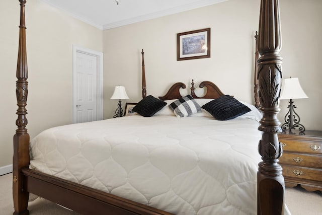 bedroom with carpet flooring, crown molding, and baseboards