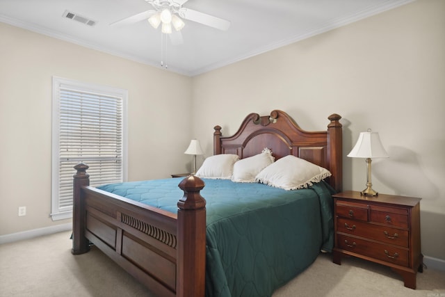 bedroom featuring light colored carpet, ornamental molding, baseboards, and ceiling fan