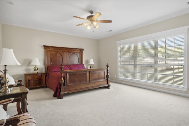 bedroom with light carpet, crown molding, ceiling fan, and baseboards