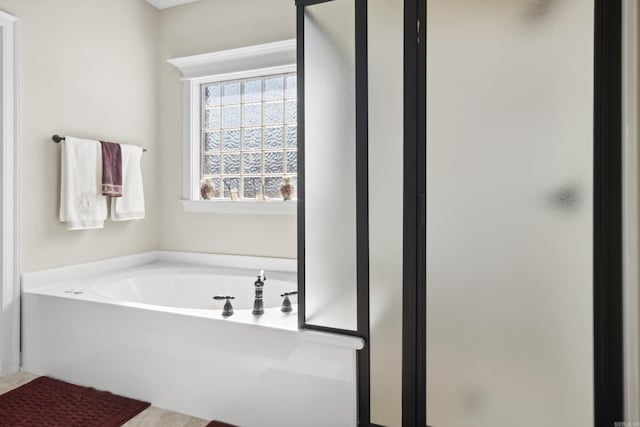 full bath featuring a shower stall and a bath
