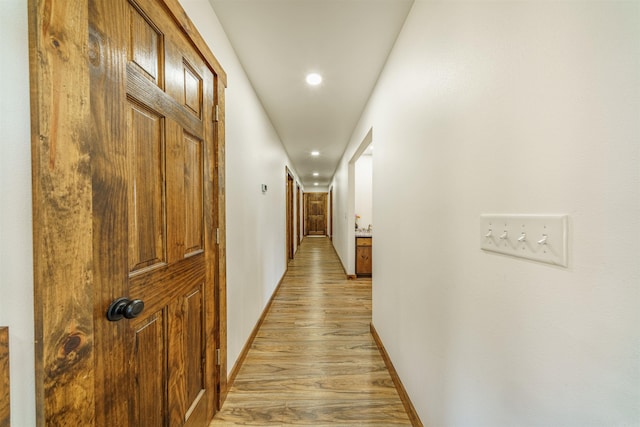 hallway featuring light hardwood / wood-style flooring