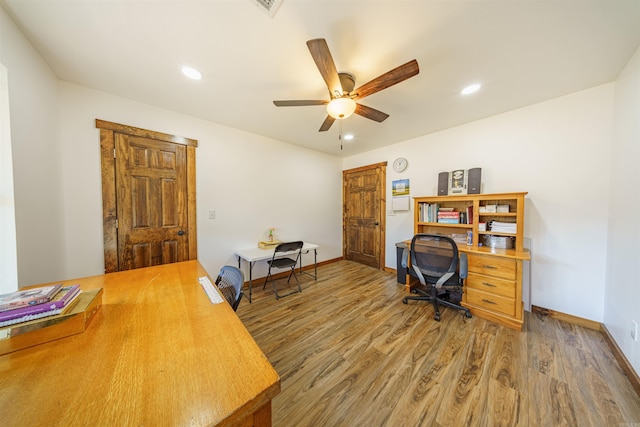 office area with wood-type flooring and ceiling fan