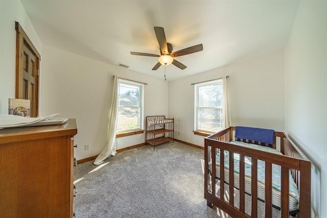 bedroom featuring light colored carpet and ceiling fan