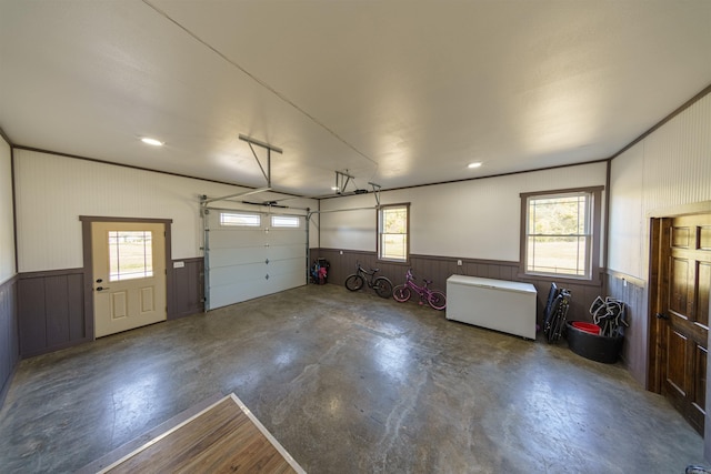 garage featuring wood walls