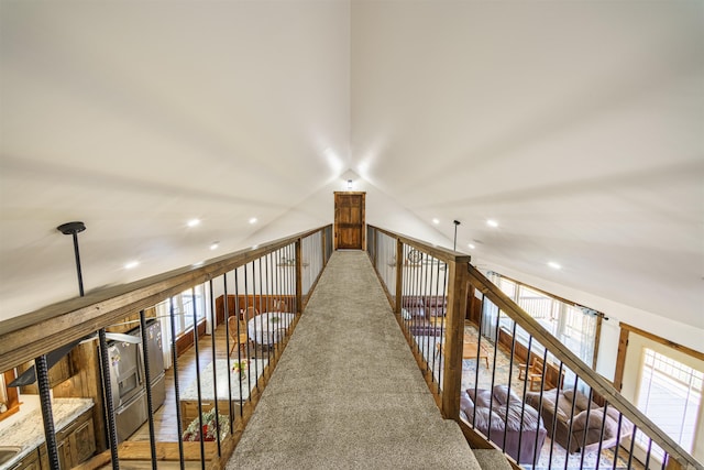 interior space featuring lofted ceiling and carpet