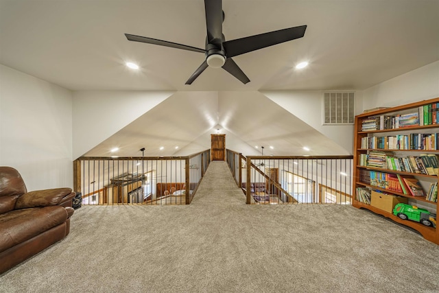 living area featuring ceiling fan and carpet floors