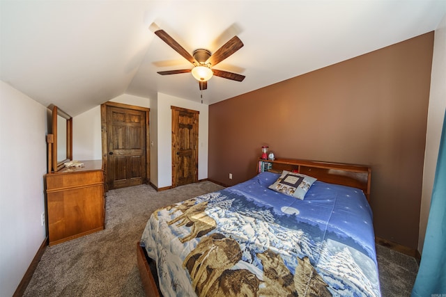 carpeted bedroom featuring lofted ceiling and ceiling fan