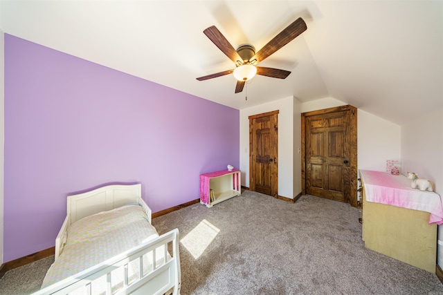 bedroom featuring light carpet, vaulted ceiling, and ceiling fan