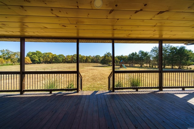 wooden deck with a playground