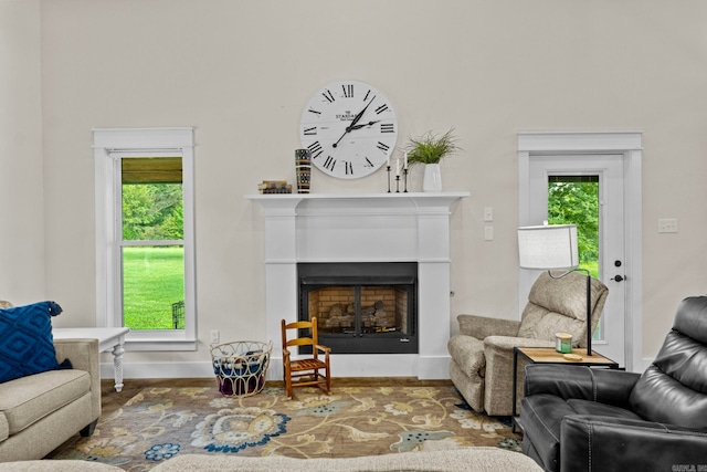 living room with hardwood / wood-style floors and a healthy amount of sunlight