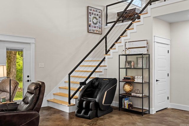 stairway with concrete floors