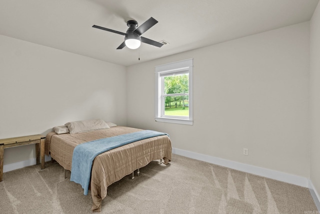 carpeted bedroom featuring ceiling fan