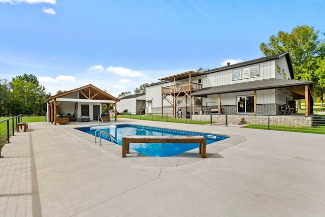 view of swimming pool featuring a patio area