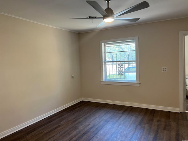 empty room featuring ceiling fan, ornamental molding, and dark hardwood / wood-style floors