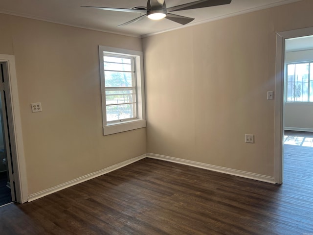 spare room with ornamental molding, ceiling fan, and dark hardwood / wood-style flooring