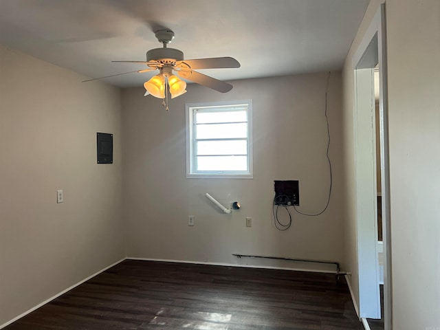 unfurnished room with ceiling fan and dark hardwood / wood-style flooring