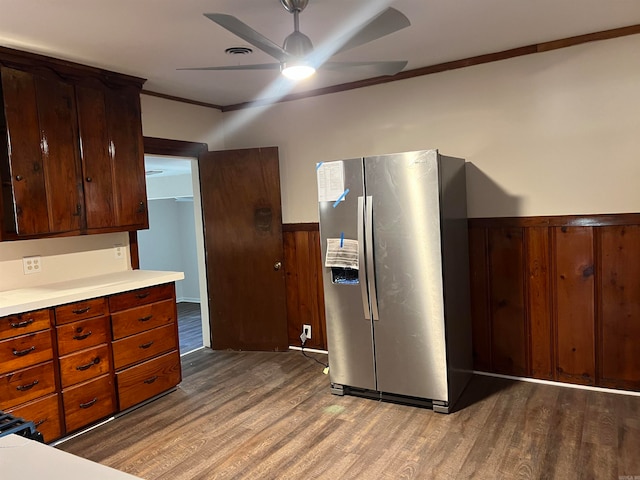 kitchen featuring crown molding, stainless steel fridge with ice dispenser, light wood-type flooring, and ceiling fan