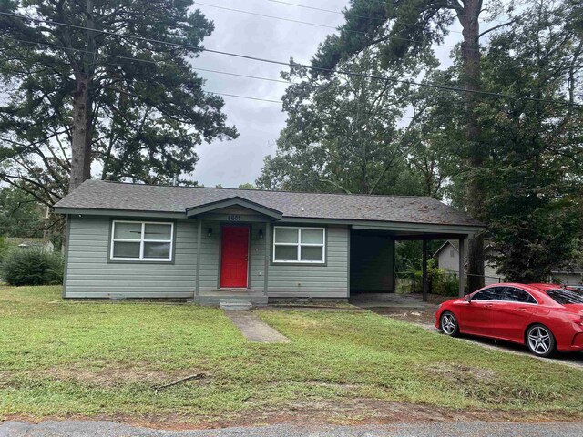 4028 Arapaho Trl, Little Rock, AR 72209 - view of front of home with an attached carport and a front yard
