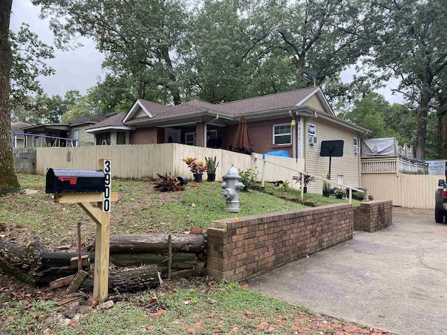 4028 Arapaho Trl, Little Rock, AR 72209 - view of front of house with fence and roof with shingles