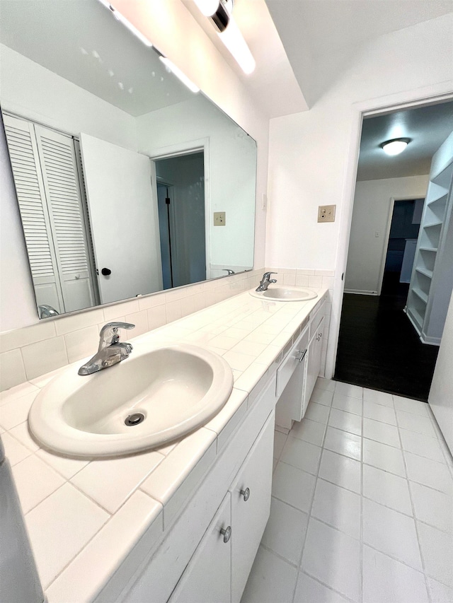 bathroom with vanity and tile patterned flooring