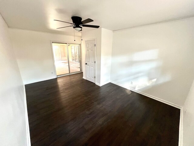 spare room with ceiling fan and dark hardwood / wood-style flooring