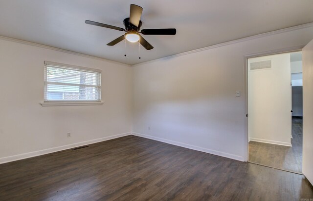 spare room featuring ornamental molding, ceiling fan, and dark hardwood / wood-style flooring