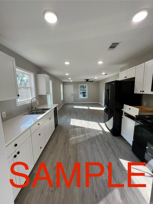 kitchen featuring white cabinetry, ceiling fan, sink, and dark hardwood / wood-style flooring