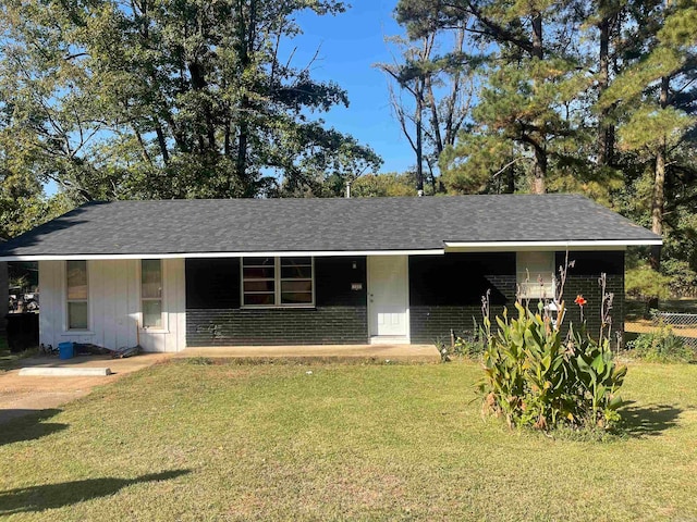 ranch-style home with a front lawn