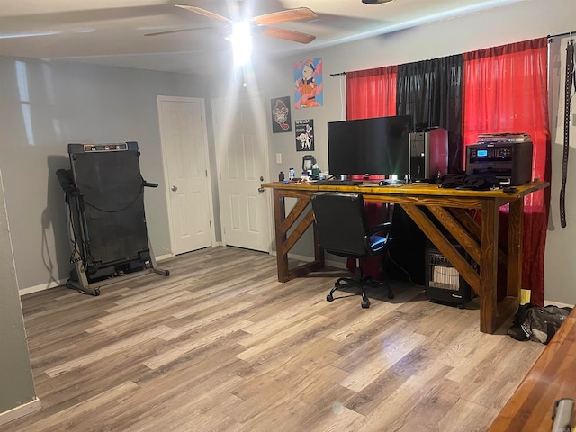 home office with ceiling fan and hardwood / wood-style flooring