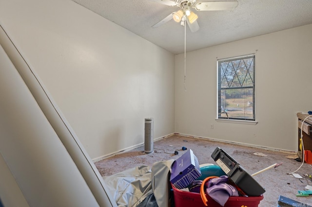 miscellaneous room with carpet, a textured ceiling, and ceiling fan