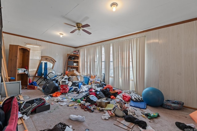 interior space with crown molding, carpet floors, and ceiling fan