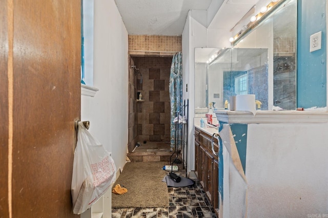 bathroom featuring vanity and a shower with shower curtain