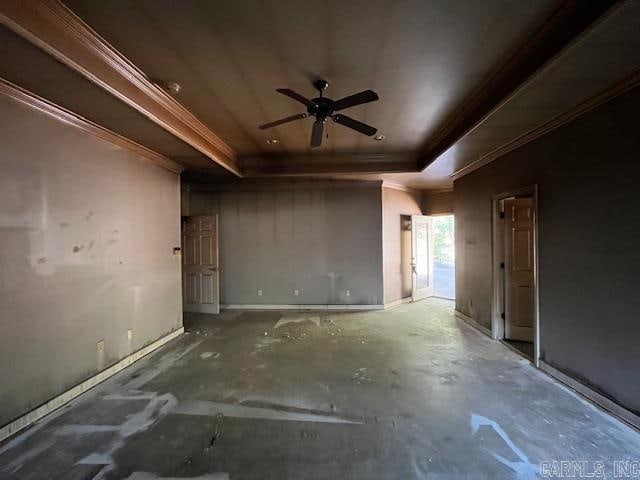 empty room with ceiling fan, crown molding, and a tray ceiling